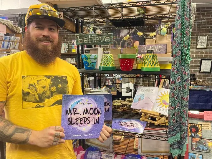 A local maker with his work in the gallery